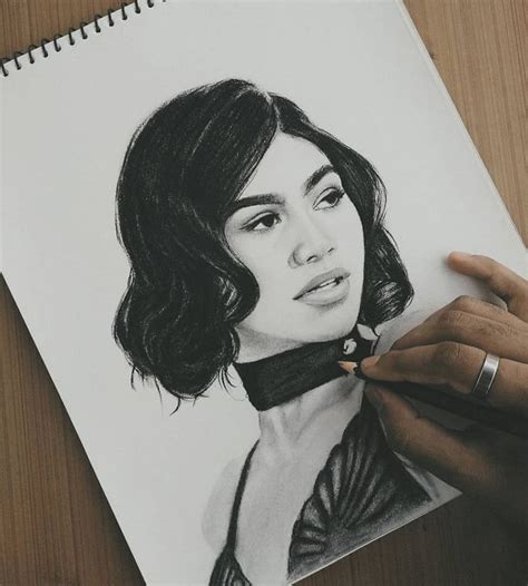 A Drawing Of A Womans Face Is Being Drawn By Someone With A Pencil
