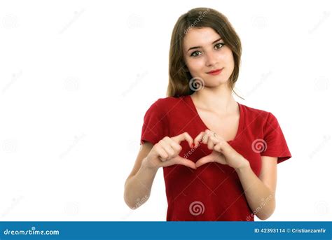 Smiling Teenager Girl Making Heart Shape With Her Hands Stock Photo