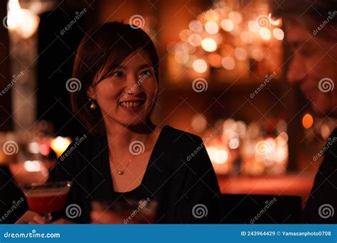 Woman drinking at the bar stock image. Image of adult - 243964429