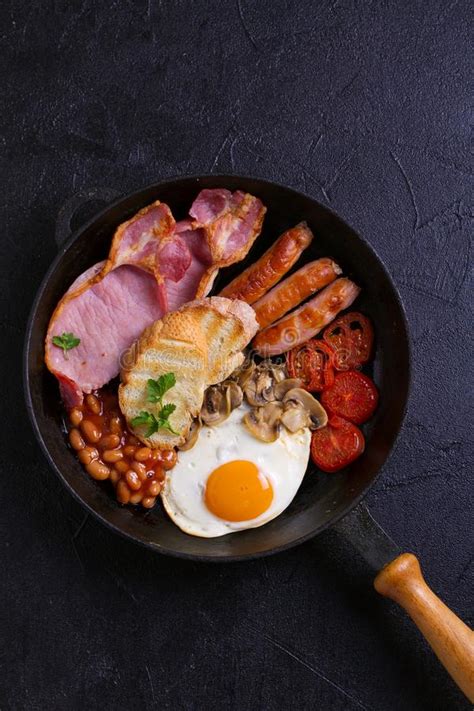 English Or Irish Breakfast With Sausages Bacon Eggs Tomatoes