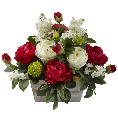 Arranged In A Rustic Whitewashed Wooden Planter This Charming Floral