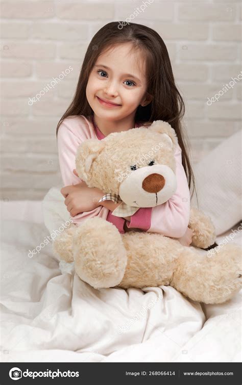 Baby Hugging A Teddy Bear Stock Photo By ©erstudio 268066414