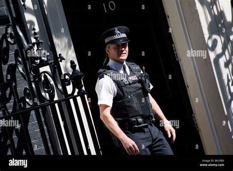 An Armed Policeman Comes Out Of The Door Of Number 10 Downing Street The Residence Of The Prime