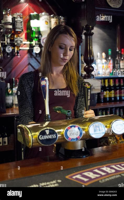 Barmaid Pouring A Pint In A Traditional British Pub The Eldon Arms