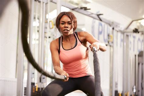 Woman working out at a gym — Stock Photo © monkeybusiness #98228916