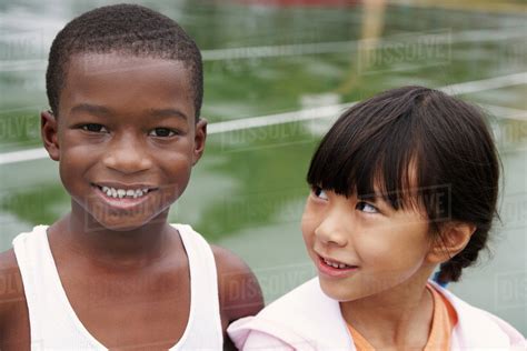 Multi Ethnic Children On Playground Stock Photo Dissolve