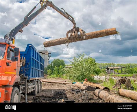 Process Of Loading Scrap Metal Into Truck Using Hydraulic Grab Loader