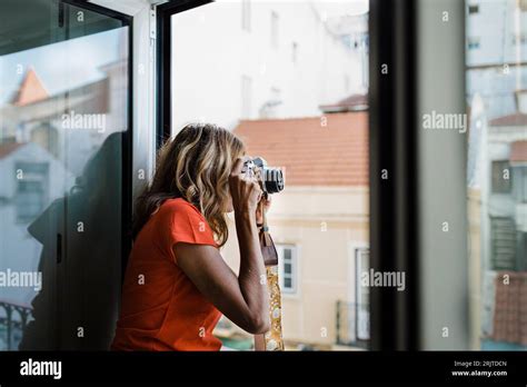 Mature Woman Photographing Through Camera Stock Photo Alamy