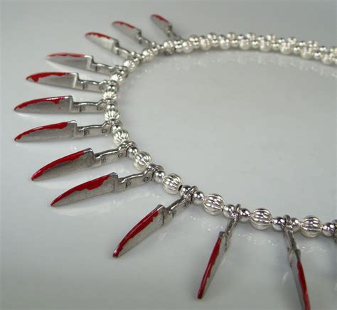 21 Bloody Knives Necklace Silver Psycho Knife