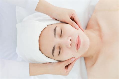 Premium Photo Midsection Of Woman Massaging Customer Lying On Table