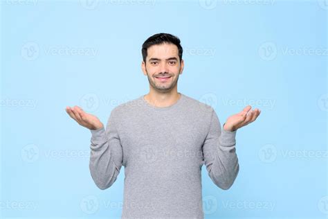 Half Body Portrait Of Smiling Man In Gray T Shirt With Open Hand