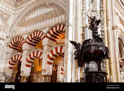 Famous alternating voussoirs of the double arches at the Great Mosque of Cordoba consisting of ...