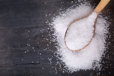 Sea Salt In A Wooden Spoon On Wooden Table Stock Photo Image Of Salt