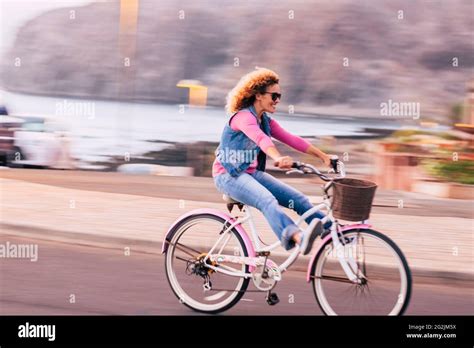 Blurred and motion picture with cheerful joyful young woman enjoying ...