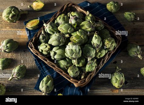 Healthy Raw Green Organic Baby Artichokes In A Basket Stock Photo Alamy