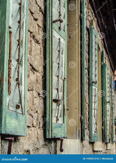 Row Of Wooden Jalousie Windows On A Brick Wall Royalty-Free Stock Image