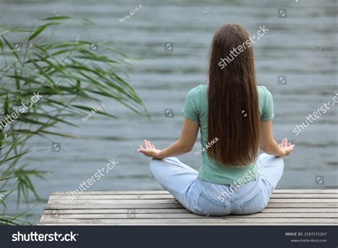 Teenage Girl Meditating Near River Back Stock Photo 2183315267