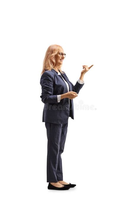 Mature Woman Cleaning Her Face With A Cotton Pad And Face Tonic In A Bathroom Stock Image