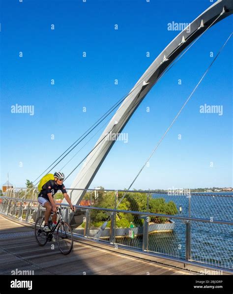 Male Cyclistriding Bike Over The Elizabeth Quay Bridge A Pedestrian