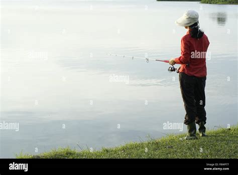 Early Morning Fishing Lady Stock Photo Alamy