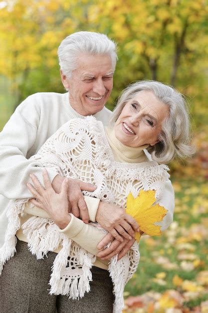 Premium Photo Portrait Of Beautiful Senior Couple Embracing In The Park