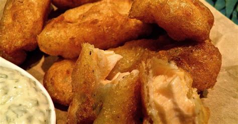 Some Fried Food Is Sitting On A Plate With Dipping Sauce In The Bowl