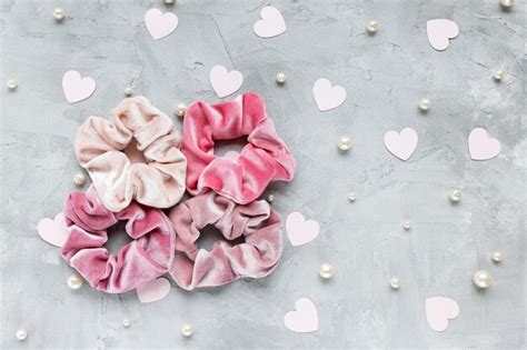 Premium Photo Four Trendy Velvet Scrunchies Pastel Pink Paper Hearts