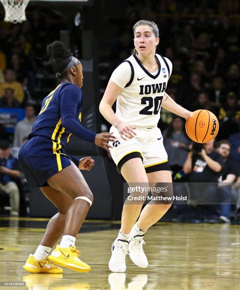 Guard Kate Martin of the Iowa Hawkeyes moves the ball down the floor ...