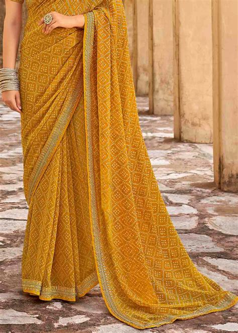 Buy Rajah Yellow Georgette Leheriya Printed Saree With Embroidered