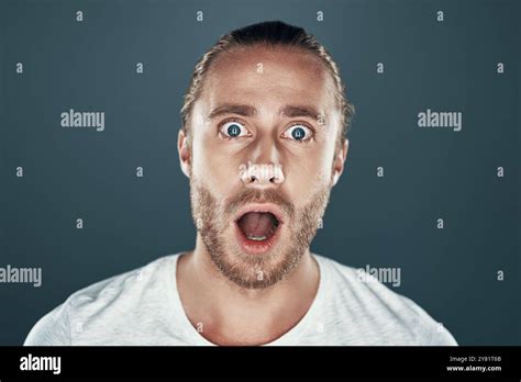 Breaking News Shocked Young Man Looking At Camera And Making A Face