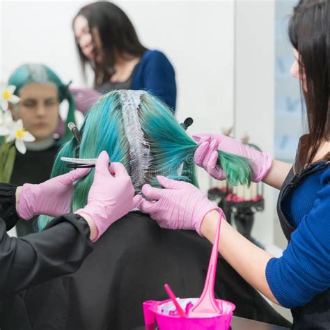 Process Of Hair Dyeing In Beauty Salon Two Hairdressers Applying Paint