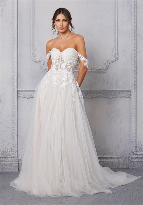 The Soft Tulle A Line Wedding Dress Has A Sweetheart Bodice And Detachable Off The Shoulder