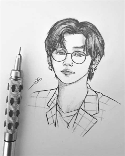 a pencil drawing of a man with glasses and a polka dot pen next to it