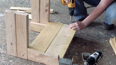 a person working on some wood with a drill