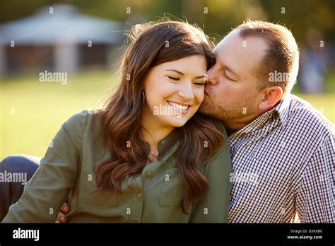 Women Kissing Man On Cheek High Resolution Stock Photography And Images