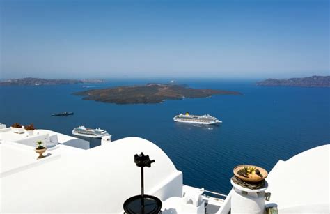 Premium Photo | Cruise ship near volcano on island of santorini