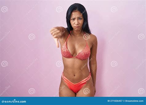 Hispanic Woman Wearing Bikini Looking Unhappy And Angry Showing Rejection And Negative With