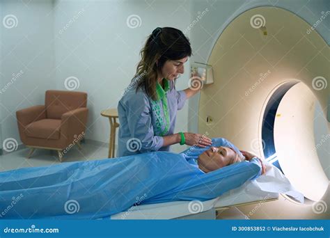 Radiologic Technologist Is Preparing Patient For Diagnostic Computed