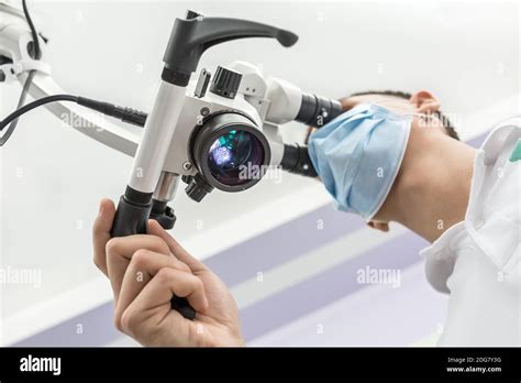 Using a dental microscope Stock Photo - Alamy