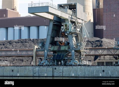 Coal Crane With Mountains Of Coal At Coal Power Plant For Electricity