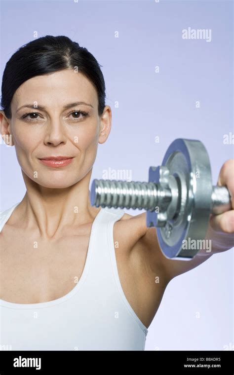 A Woman Lifting A Dumbbell Stock Photo Alamy