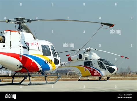 --FILE--Two helicopters purchased by Huaxi Village for tourism are ...