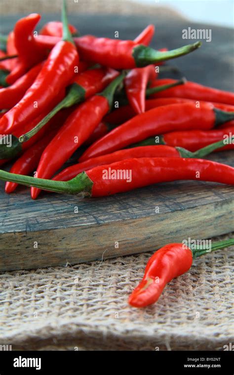 Red Hot Chili Peppers Over Wooden Background Stock Photo Alamy