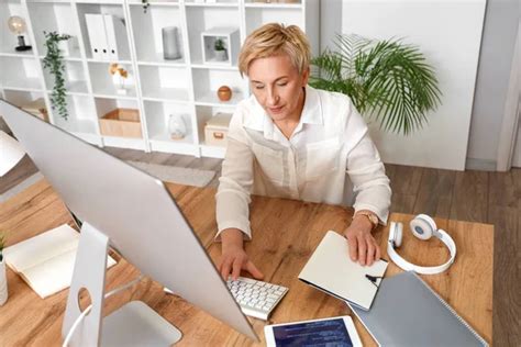 Mature Female Programmer Working Computer Table Office Stock Photo