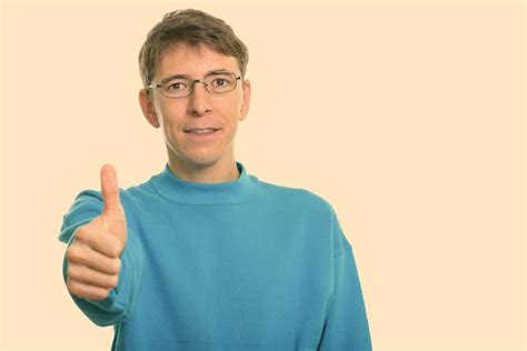 Premium Photo Portrait Of Man Wearing Eyeglasses Against Black Background