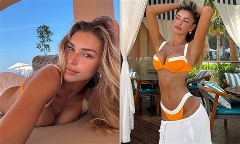 Zara McDermott Flashes Her Cleavage In A Bright Orange Bikini As She Poses For Sexy Snaps During
