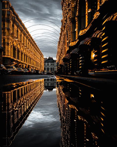 HD wallpaper: water on asphalt road with reflection of fully-decorated buildings under cloudy ...