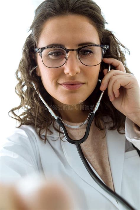 Female Doctor Checking Patient Heartbeat Using Stethoscope Stock Image