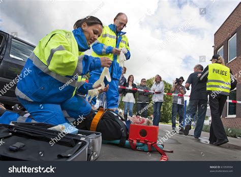 Paramedics Tending First Aid Injured Woman Stock Photo 61059934