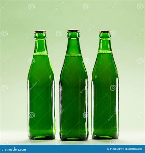 Three Green Bottles On A Light Green Background Stock Image Image Of Liquid Alcohol 112665709